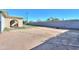 Large backyard with grassy area and block wall at 6649 W Orange Dr, Glendale, AZ 85301