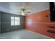 Bright bedroom with ceiling fan and window at 6649 W Orange Dr, Glendale, AZ 85301