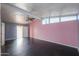 A bedroom with pink and gray walls and a ceiling fan at 6649 W Orange Dr, Glendale, AZ 85301