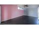 A bedroom with pink and gray walls and a ceiling fan at 6649 W Orange Dr, Glendale, AZ 85301