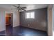 Bedroom with window, closet, and ceiling fan at 6649 W Orange Dr, Glendale, AZ 85301