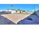 Rear view of single story house with large backyard at 6649 W Orange Dr, Glendale, AZ 85301