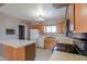 Kitchen featuring wood cabinets and appliances at 6649 W Orange Dr, Glendale, AZ 85301