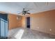 Kitchen area with wood paneling, tiled floor, and a ceiling fan at 6649 W Orange Dr, Glendale, AZ 85301