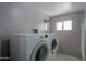 Laundry room with washer and dryer, and a window at 6649 W Orange Dr, Glendale, AZ 85301