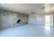 Living room with brick fireplace and ceiling fan at 6649 W Orange Dr, Glendale, AZ 85301