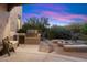 Outdoor kitchen area with built-in grill and fire pit at 6708 E Calle De Las Estrellas Rd, Cave Creek, AZ 85331