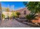 Landscaped backyard with seating area and water feature at 6730 E Hermosa Vista Dr # 75, Mesa, AZ 85215