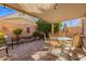 Covered patio with seating area, fountain, and string lights at 6730 E Hermosa Vista Dr # 75, Mesa, AZ 85215