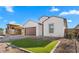 New construction home with brown garage door and grassy front yard at 699 E Greenback Dr, San Tan Valley, AZ 85140