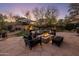 Relaxing backyard patio with fire pit and seating area, perfect for outdoor entertaining at 7040 N 1St Ave, Phoenix, AZ 85021