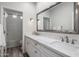 Double vanity bathroom with marble countertops and a shower at 7040 N 1St Ave, Phoenix, AZ 85021