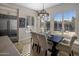 Bright breakfast nook features built-in window seating and stylish chandelier at 7040 N 1St Ave, Phoenix, AZ 85021