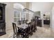 Elegant dining room with a farm table and access to the kitchen at 7040 N 1St Ave, Phoenix, AZ 85021