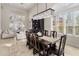 Formal dining room with a large table and a crystal chandelier at 7040 N 1St Ave, Phoenix, AZ 85021