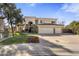 Spacious two-story home with a three-car garage and manicured lawn at 7040 N 1St Ave, Phoenix, AZ 85021