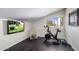 Home gym with Peloton bike, TV, and weights at 7040 N 1St Ave, Phoenix, AZ 85021