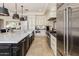 Modern kitchen with center island, stainless steel appliances, and custom cabinetry at 7040 N 1St Ave, Phoenix, AZ 85021