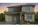 Two-story house with a neutral color scheme and a two-car garage at 7929 E Queensborough Ave, Mesa, AZ 85212