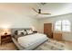 Main bedroom with king-size bed and wood-toned dresser at 8018 N 3Rd Pl, Phoenix, AZ 85020