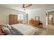 Bedroom with king bed, mid-century dresser and arched window at 8018 N 3Rd Pl, Phoenix, AZ 85020