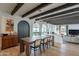 Bright dining area with wood table and exposed beams at 8018 N 3Rd Pl, Phoenix, AZ 85020