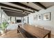 Open concept dining area with wood table and modern light fixture at 8018 N 3Rd Pl, Phoenix, AZ 85020