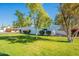 Landscaped lawn area with mature trees and shrubs at 8018 N 3Rd Pl, Phoenix, AZ 85020