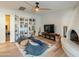 Relaxing living area with built-in shelving, fireplace, and hardwood floors at 8018 N 3Rd Pl, Phoenix, AZ 85020