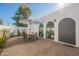 Outdoor patio with seating area, umbrella, and adjacent to the home's entrance at 8018 N 3Rd Pl, Phoenix, AZ 85020