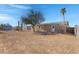 Large backyard with a dirt lot and a tree at 8155 E Baltimore St, Mesa, AZ 85207