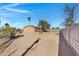 Large backyard with a wooden fence and desert landscaping at 8155 E Baltimore St, Mesa, AZ 85207