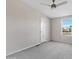 Bright bedroom with carpeted floor and ceiling fan at 8155 E Baltimore St, Mesa, AZ 85207