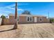 House exterior, tan siding, white door, and mature palm tree at 8155 E Baltimore St, Mesa, AZ 85207