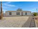 Charming single story home featuring a paved drive, neutral paint, desert landscaping and mature palm tree at 8155 E Baltimore St, Mesa, AZ 85207