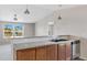 Kitchen island with granite countertop and double sink at 8155 E Baltimore St, Mesa, AZ 85207