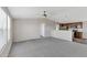 Open living room with grey carpet and a view of the kitchen at 8155 E Baltimore St, Mesa, AZ 85207