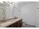 Bathroom with double sinks and dark cabinets at 9036 E Halifax Cir, Mesa, AZ 85207