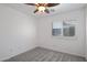 Small bedroom with window shutters and carpet at 9036 E Halifax Cir, Mesa, AZ 85207