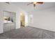 Bright bedroom with mirrored closet and carpet at 9036 E Halifax Cir, Mesa, AZ 85207