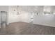 Dining room with hardwood floors and a modern chandelier at 9036 E Halifax Cir, Mesa, AZ 85207