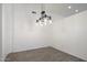 Simple dining room with hardwood floors and a modern chandelier at 9036 E Halifax Cir, Mesa, AZ 85207