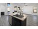 Kitchen island with sink, dishwasher, and ample counter space at 9036 E Halifax Cir, Mesa, AZ 85207