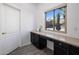 Laundry room with built-in counter and cabinets at 9036 E Halifax Cir, Mesa, AZ 85207