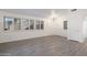 Bright living room featuring hardwood floors and plantation shutters at 9036 E Halifax Cir, Mesa, AZ 85207