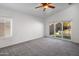 Main bedroom with sliding glass doors to patio at 9036 E Halifax Cir, Mesa, AZ 85207