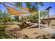 Community playground with shade structures and play equipment at 9036 E Halifax Cir, Mesa, AZ 85207