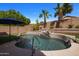 Relaxing kidney shaped pool with waterfall at 9036 E Halifax Cir, Mesa, AZ 85207