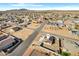 Aerial view of a house with solar panels in a residential area at 9163 W Swansea Dr, Arizona City, AZ 85123