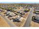 Aerial view showing home with solar panels, in a residential neighborhood at 9163 W Swansea Dr, Arizona City, AZ 85123